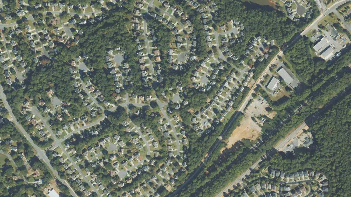 Aerial view of a subdivision of single-family homes in Duluth.