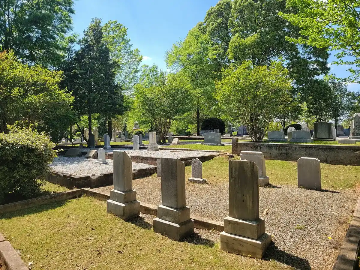 Old headstones under shade trees in the Duluth Church Cemetery