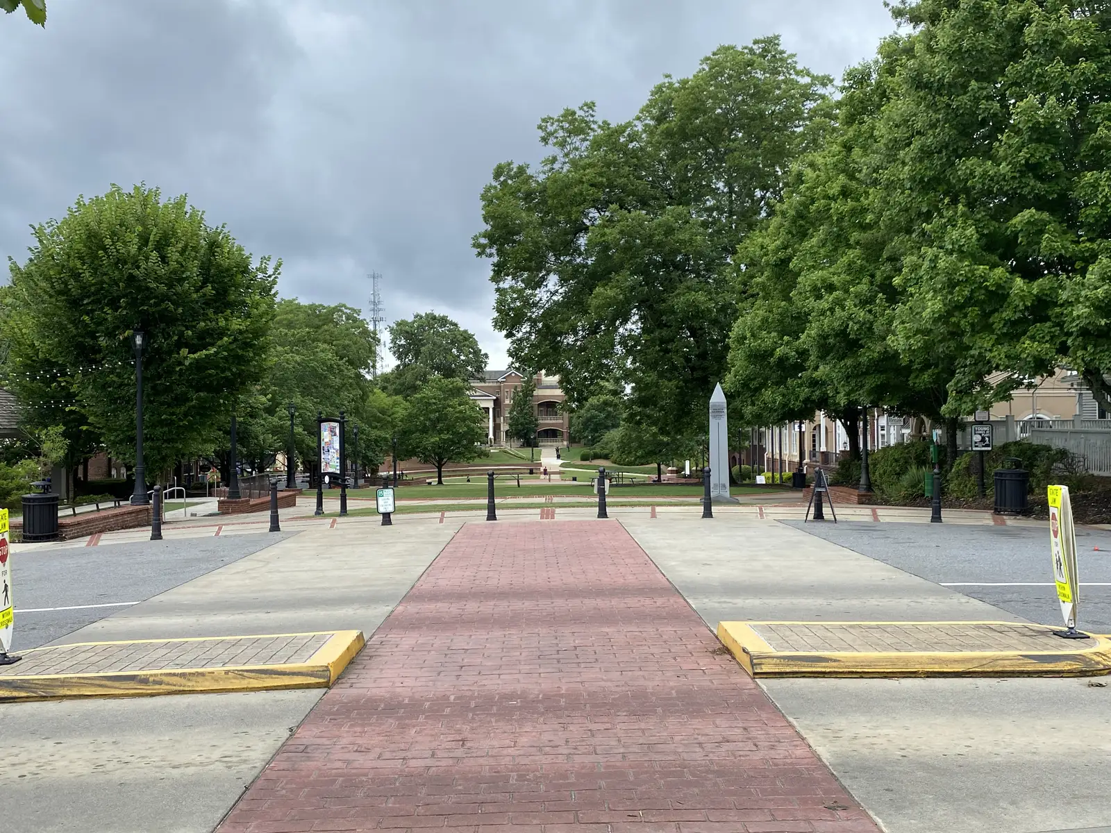 A brick crosswalk on Main Street leading to the Town Green in downtown Duluth, part of which is zoned for Harris Elementary