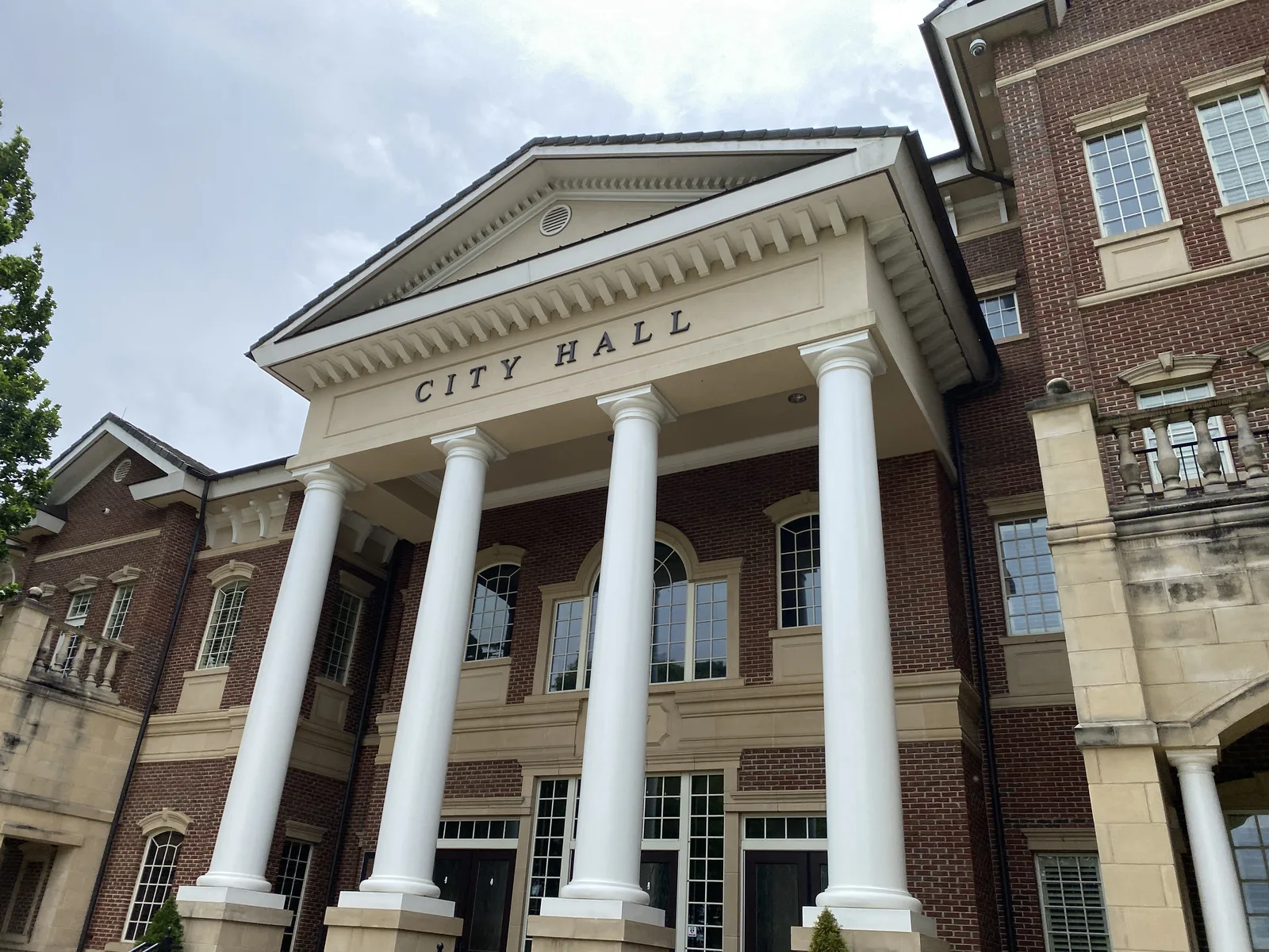 The columned entrance of Duluth City Hall, which faces the Town Green on Main Street